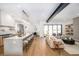Bright, open-concept kitchen flowing into the living area, featuring a large island and modern finishes at 1117 S Madison St, Denver, CO 80210