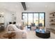 Cozy living area with comfortable seating, a large window, and an open floor plan at 1117 S Madison St, Denver, CO 80210