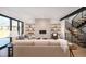 Bright living room features a fireplace, built-in shelves, and a staircase at 1117 S Madison St, Denver, CO 80210