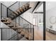 Modern staircase with wood steps and metal railings leading to the upper floors at 1117 S Madison St, Denver, CO 80210