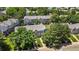 Aerial shot of townhomes surrounded by lush trees at 10567 W Dartmouth Ave, Lakewood, CO 80227