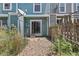 View of backyard featuring stone landscaping and sliding glass door at 10567 Dartmouth, Lakewood, CO 80227