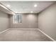 Finished basement area with a window providing natural light at 10567 Dartmouth, Lakewood, CO 80227