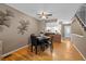 Cozy dining area featuring a wooden table set, hardwood floors and view of kitchen at 10567 Dartmouth, Lakewood, CO 80227