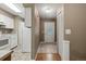 Inviting entryway with tile flooring and decorative glass front door, flowing into the adjacent kitchen area at 10567 W Dartmouth Ave, Lakewood, CO 80227