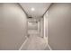 Basement hallway featuring carpet, neutral colors, and recessed lighting at 10567 W Dartmouth Ave, Lakewood, CO 80227