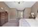 Spacious main bedroom featuring soft carpeting, ample closet space, and serene decor at 10567 W Dartmouth Ave, Lakewood, CO 80227