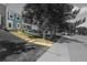 Exterior view of a charming townhome with manicured lawn and walkway leading to the front door at 10567 W Dartmouth Ave, Lakewood, CO 80227