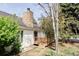 Backyard featuring a stone chimney and a wooden deck at 4530 S Verbena St # 316, Denver, CO 80237