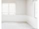 Bright bedroom with neutral carpet and ample natural light from two windows at 4530 S Verbena St # 316, Denver, CO 80237