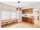 Light-filled breakfast nook with built-in bench seating and modern lighting at 4530 S Verbena St # 316, Denver, CO 80237