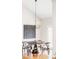 Cozy dining area featuring a round table, modern lighting, and hardwood floors, creating a warm ambiance at 4530 S Verbena St # 316, Denver, CO 80237