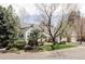 Well-kept home with a manicured lawn, mature trees, and a brick-lined walkway, showcasing its curb appeal at 4530 S Verbena St # 316, Denver, CO 80237