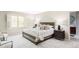 Spacious main bedroom featuring a large window and ensuite bathroom access at 4530 S Verbena St # 316, Denver, CO 80237