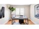 Bright office space with hardwood floors, natural light, and a decorative desk at 4530 S Verbena St # 316, Denver, CO 80237
