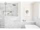 Contemporary glass shower with built-in shelving and sleek marble tiling at 4530 S Verbena St # 316, Denver, CO 80237