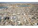 Wide aerial view showcasing neighborhood close to the mountains and a lake at 4351 Yates St, Denver, CO 80212