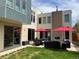 Private backyard patio featuring outdoor seating, a fireplace, and lush lawn perfect for entertaining at 4351 Yates St, Denver, CO 80212