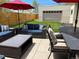 Cozy backyard patio featuring outdoor seating, coffee table, and manicured lawn at 4351 Yates St, Denver, CO 80212