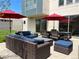 Spacious backyard patio with multiple seating areas, dining set, and manicured lawn at 4351 Yates St, Denver, CO 80212