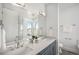 Elegant bathroom with double sinks, quartz countertops, and modern fixtures at 4351 Yates St, Denver, CO 80212