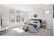 Sunlit bedroom featuring soft carpet, ample windows and a minimalist design at 4351 Yates St, Denver, CO 80212