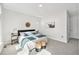 Well-lit bedroom with neutral tones, stylish decor, and plush carpet, ideal for relaxation at 4351 Yates St, Denver, CO 80212