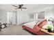 Bright bedroom with a ceiling fan, ensuite shower and a sliding door closet at 4351 Yates St, Denver, CO 80212