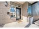 Inviting front porch features a modern design with an eye-catching brick exterior at 4351 Yates St, Denver, CO 80212