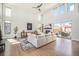 Bright, open living room showcasing hardwood floors, a fireplace, and access to the backyard at 4351 Yates St, Denver, CO 80212
