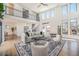 Bright, open living room with tall ceilings, large windows, and a modern staircase at 4351 Yates St, Denver, CO 80212