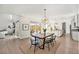 Open concept living space flows from the dining area to the patio, kitchen, and fireplace at 4351 Yates St, Denver, CO 80212