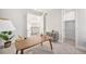 Bright home office with a modern desk, stylish decor, and an adjacent walk-in closet at 4351 Yates St, Denver, CO 80212