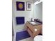 Modern bathroom featuring a stylish vanity with art decorations and a large mirror at 603 Inca St # 429, Denver, CO 80204