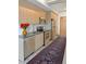Well-lit kitchen featuring stainless steel appliances and wood cabinetry, and a stylish rug at 603 Inca St # 429, Denver, CO 80204