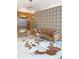 Inviting lobby area with stylish seating, a cowhide rug, and decorative wall feature at 603 Inca St # 429, Denver, CO 80204