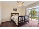 Bedroom with sliding glass door provides access to outdoors and abundant natural light at 7440 S Blackhawk St # 4-102, Englewood, CO 80112
