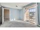 Serene bedroom with open doors and sliding glass doors for ample light and indoor-outdoor flow at 7440 S Blackhawk St # 4-102, Englewood, CO 80112