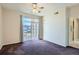Bright bedroom featuring a sliding glass door for plenty of natural light at 7440 S Blackhawk St # 4-102, Englewood, CO 80112