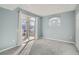 Bedroom with light blue walls, a large window and carpeted floors offers a serene and comfortable space at 7440 S Blackhawk St # 4-102, Englewood, CO 80112