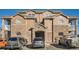 Beautiful multi-Gathering building features stone accents, private balconies, and assigned parking in a well-maintained neighborhood at 7440 S Blackhawk St # 4-102, Englewood, CO 80112