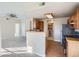 Well-lit kitchen with wooden cabinets, modern appliances, and tile flooring that connects to a spacious living area at 7440 S Blackhawk St # 4-102, Englewood, CO 80112