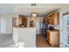 Well-equipped kitchen featuring wooden cabinets, stainless steel appliances, and a breakfast bar for casual dining at 7440 S Blackhawk St # 4-102, Englewood, CO 80112