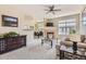 Bright living room with plush carpet, fireplace, and seamless flow to the dining area at 7440 S Blackhawk St # 4-102, Englewood, CO 80112