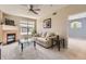 Inviting living room featuring a fireplace, neutral color palette and plush carpeting at 7440 S Blackhawk St # 4-102, Englewood, CO 80112