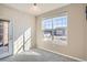 Bright room featuring a large window and a door to the balcony, providing natural light and an outdoor connection at 7440 S Blackhawk St # 4-102, Englewood, CO 80112