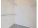 Spacious walk-in closet with shelving and carpeted floor offers ample storage space at 7440 S Blackhawk St # 4-102, Englewood, CO 80112