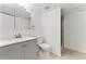 Updated bathroom featuring a modern vanity, tile floors and shower with glass door at 11542 Community Center Dr # 56, Northglenn, CO 80233