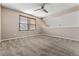 Cozy bedroom with neutral carpet, ceiling fan, window with blinds, and spacious layout at 11542 Community Center Dr # 56, Northglenn, CO 80233