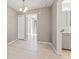 Open dining room leading to a updated bathroom, showcases wood flooring and a modern light fixture at 11542 Community Center Dr # 56, Northglenn, CO 80233